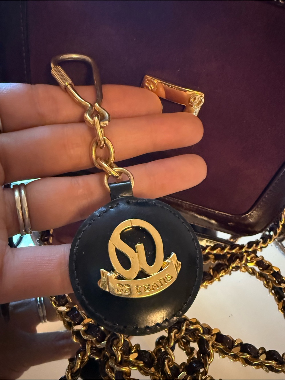 Vintage St. John Keychain 35 anniversary black and gold logo - Picture 4 of 10